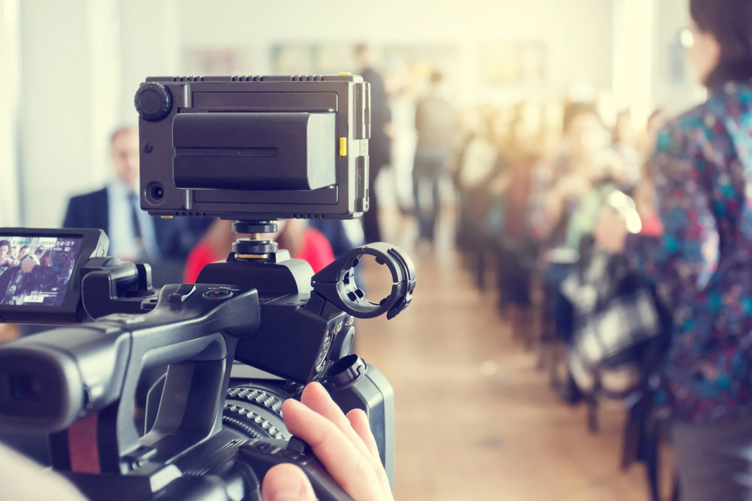 Video camera filming the event. Video camera filming the event.